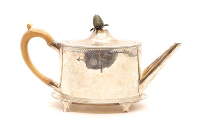Lot 6 - A George III silver teapot and stand