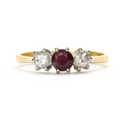 Lot 82 - An 18ct gold ruby and diamond three stone ring