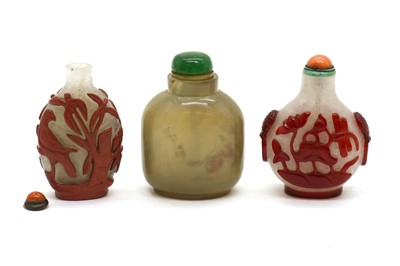 Lot 104 - A group of three Chinese Peking glass snuff bottles
