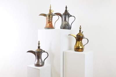 Lot 205 - A group of four large 'dallah' coffee pots