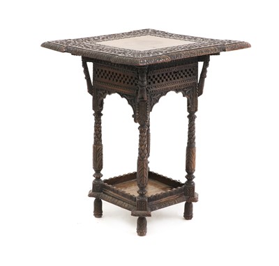 Lot 452 - A Kashmiri carved hardwood occasional table