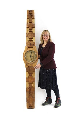 Lot 169 - A contemporary English oak and elm wall clock