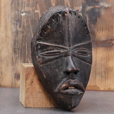 Lot 464 - Dan society: a carved and patinated Dan mask
