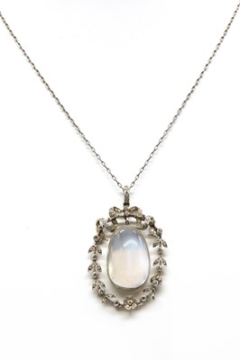 Lot 118 - An Edwardian moonstone and diamond galleried pendant