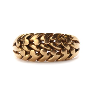 Lot 18 - An 18ct gold keeper ring