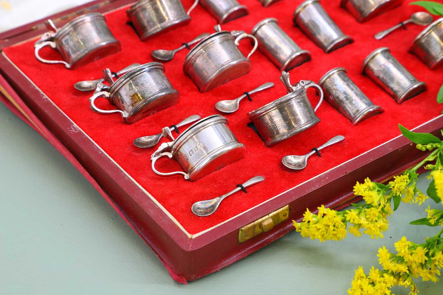 Lot 120 - An eighteen-piece cased silver cruet set