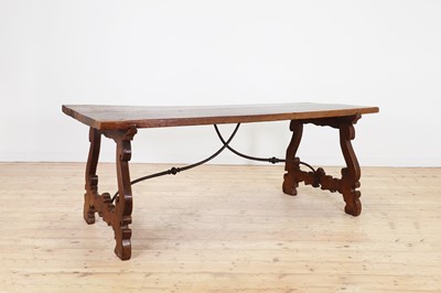 Lot 49 - A walnut and wrought iron table