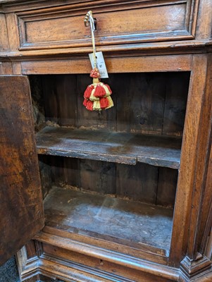 Lot 67 - A walnut credenza