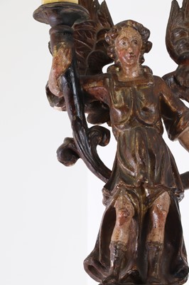 Lot 5 - A carved and polychrome painted candleholder
