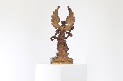 Lot 5 - A carved and polychrome painted candleholder