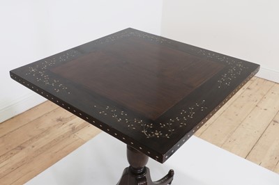 Lot 24 - A pair of teak tripod occasional tables