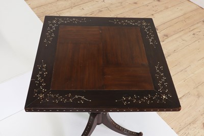 Lot 24 - A pair of teak tripod occasional tables