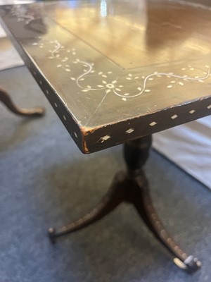 Lot 24 - A pair of teak tripod occasional tables