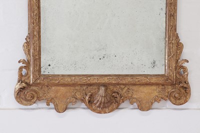 Lot 29 - A George II carved giltwood and gesso pier mirror