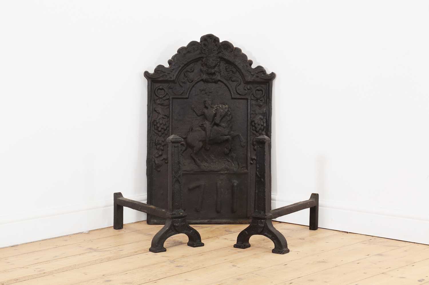 Lot 32 - A cast iron fireback in the 17th century style