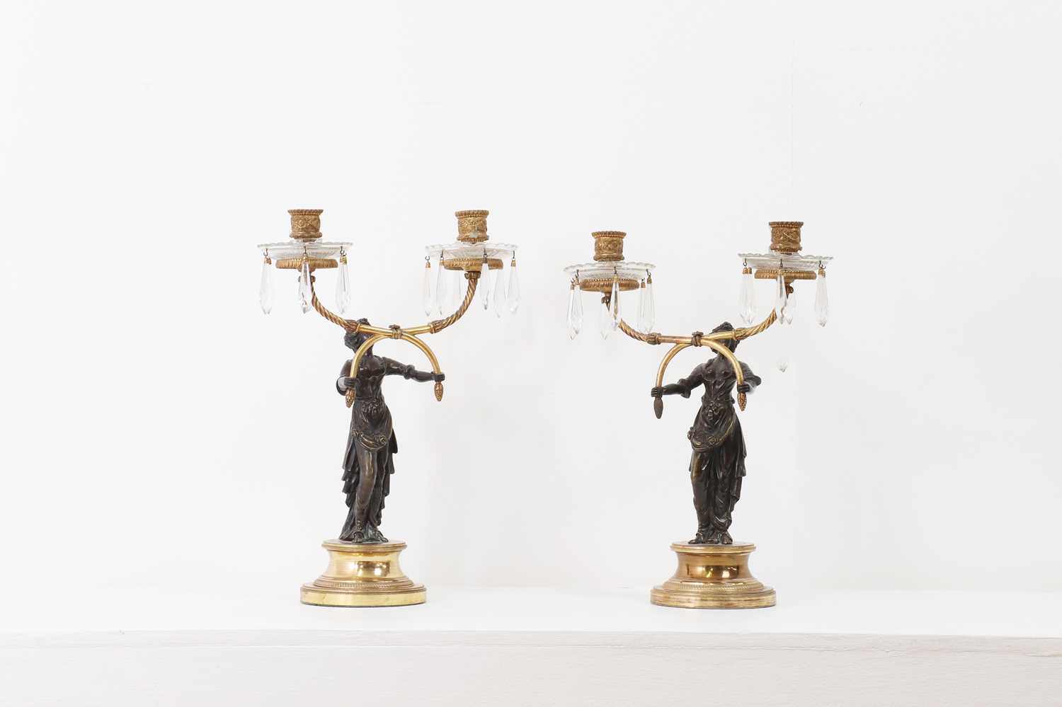 Lot 31 - A pair of Empire-style gilt and patinated bronze candelabra