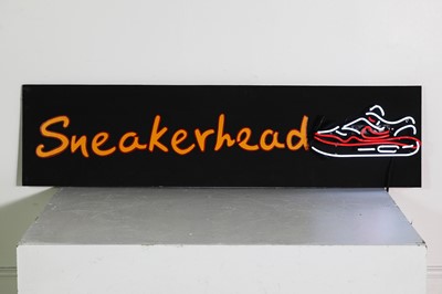 Lot 564 - A wooden sign reading 'Sneakerhead'