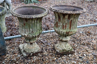 Lot 543 - A pair of cast iron campana garden urns
