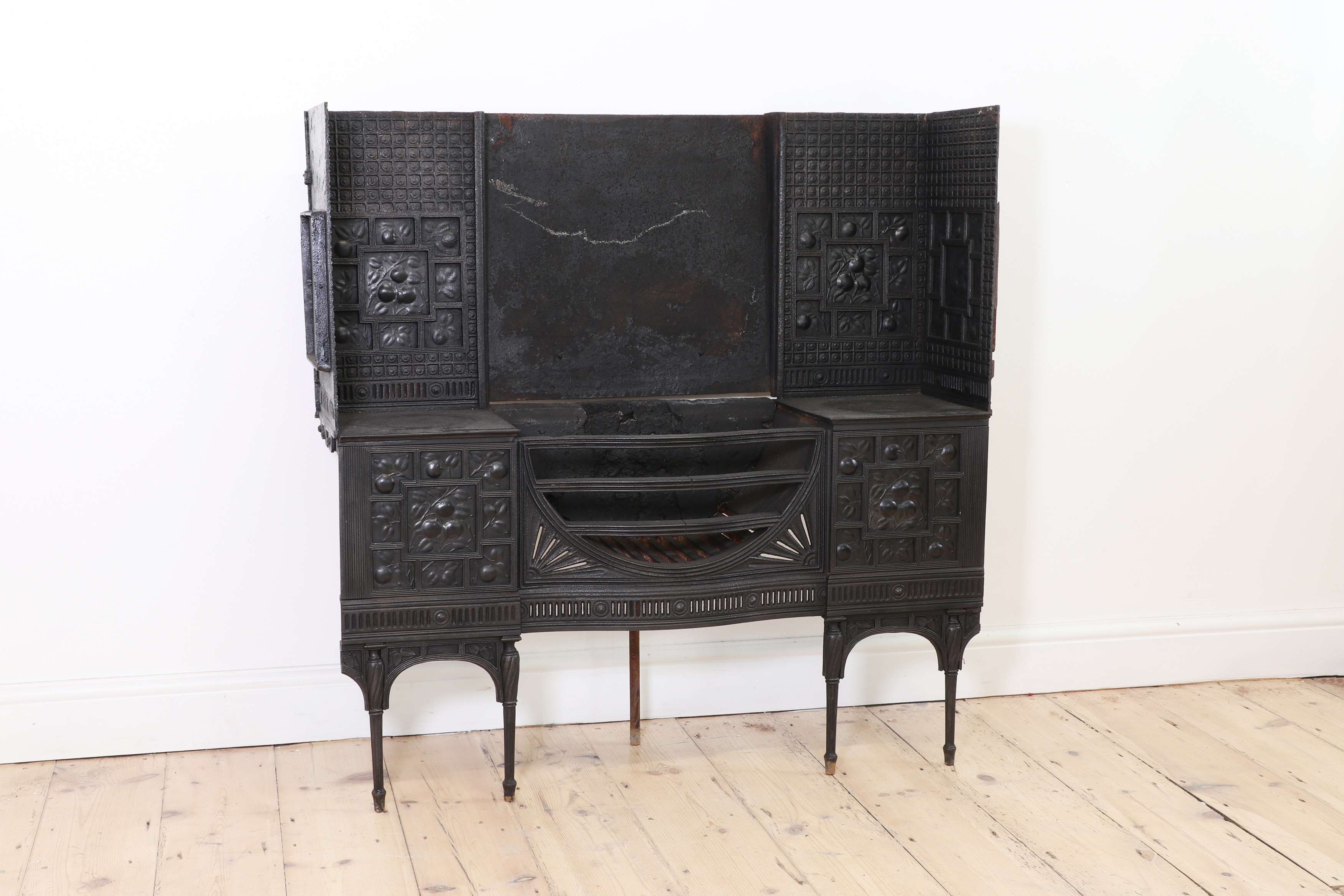 Lot 3 - An Aesthetic Coalbrookdale cast iron fireplace,
