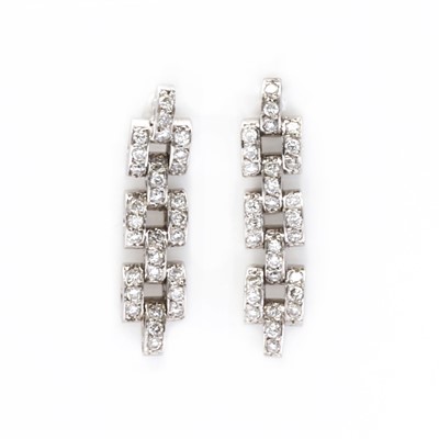 Lot 69 - A pair of white gold diamond drop earrings