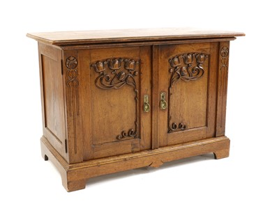 Lot 427 - A Continental Art Nouveau oak cupboard