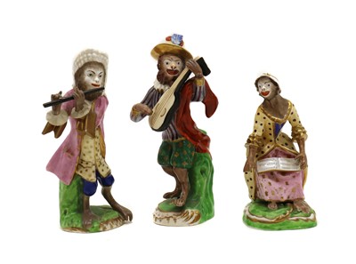 Lot 273 - Three German porcelain monkey band figures