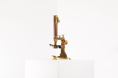 Lot 376 - A lacquered brass binocular microscope