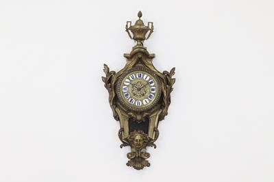 Lot 356 - A brass cartel clock