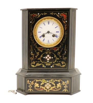 Lot 300 - A brass inlaid ebonised mantel clock