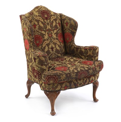 Lot 494 - A Queen Anne style walnut wing armchair