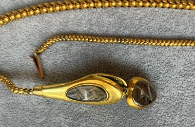 Lot 52 - A Victorian cased gold enamel and split pearl snake or serpent necklace