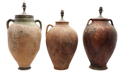 Lot 147 - A group of three earthenware amphoras