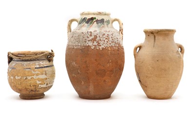 Lot 149 - A group of three earthenware jars