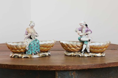 Lot 160A - A pair of Meissen porcelain figural double salts