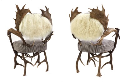 Lot 453 - A pair of antler chairs