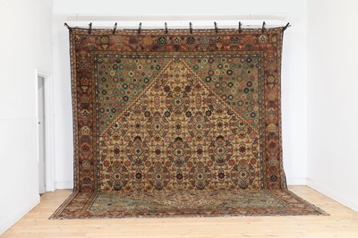 Lot 103 - A large Persian-style wool carpet