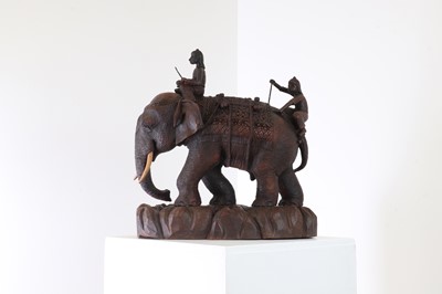 Lot 200 - A carved teak figure of an elephant