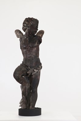 Lot 477 - A carved pine figure of a putto