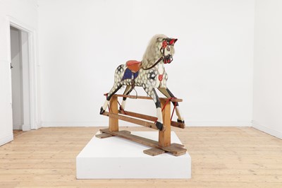 Lot 488 - A painted wooden rocking horse