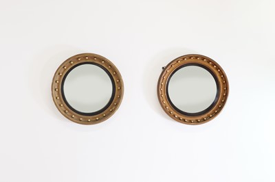 Lot 135 - A near pair of Regency-style convex mirrors