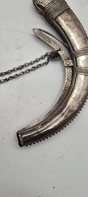 Lot 74 - An Omani silver powder horn