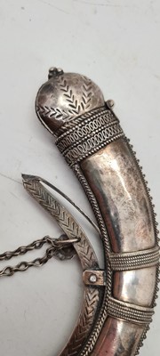 Lot 74 - An Omani silver powder horn