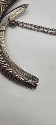 Lot 74 - An Omani silver powder horn