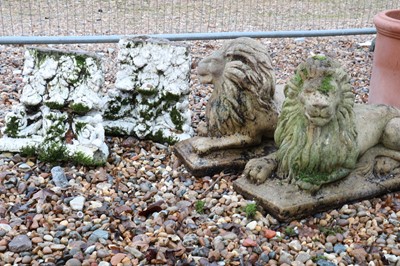 Lot 546 - A pair of composite stone lions
