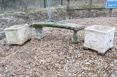 Lot 545 - A composite stone garden bench