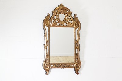 Lot 179 - A Régence-style giltwood mirror