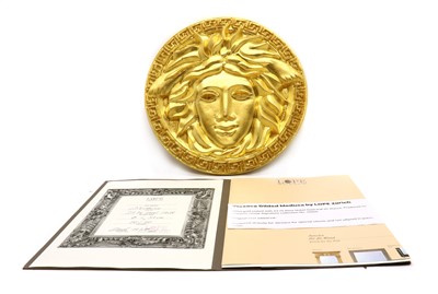 Lot 282 - A Versace gilded 'Medusa' limited edition plaster medallion