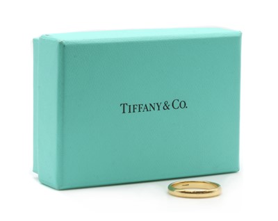 Lot 74 - An 18ct gold 'D' section wedding ring, by Tiffany & Co.