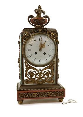 Lot 288 - A French brass and rouge marble mantel clock