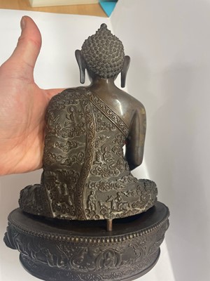 Lot 78 - A Chinese bronze Buddha